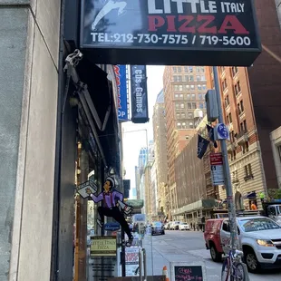a sign for little italy pizza