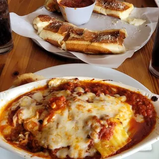 Cheesy Bread Sticks served with marinara sauce on the side