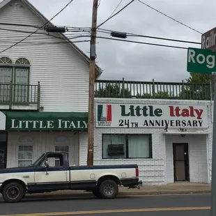 a truck parked in front of the restaurant