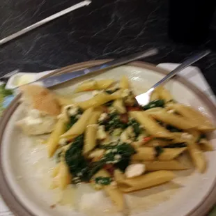 A simple meal... perfectly executed.   Penn with fresh tomatoes and spinach with feta cheese, oil and garlic
