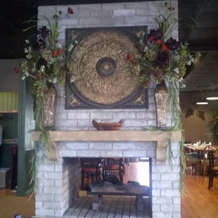 A beautiful hearth and fireplace in the center of the room