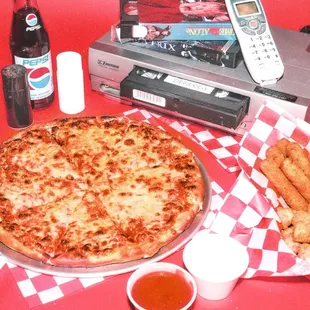 a pizza, french fries, and soda