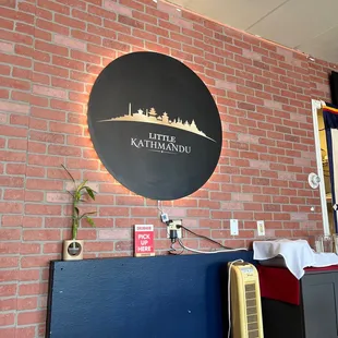 a brick wall with a sign on it