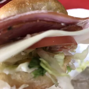 a sandwich with meat and lettuce