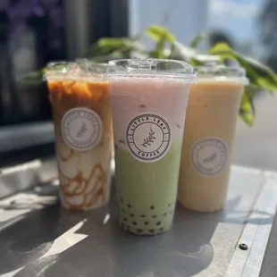 three different drinks on a table