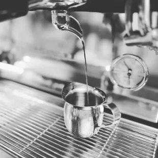 coffee being poured into a cup