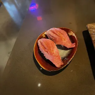 two pieces of salmon on a plate