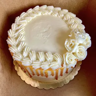 Sadly, this was unfortunately delivered to us... note the dent, uneven piping and the dreaded caramel "mucus" drip.