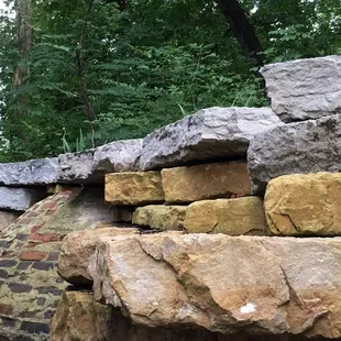 Retaining wall and exposed cistern at the Little Loomhouse