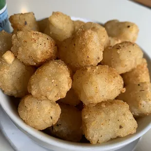 a bowl of fried tater tots