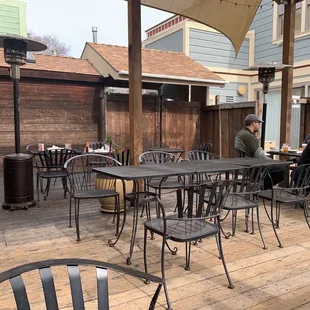 a patio with tables and chairs