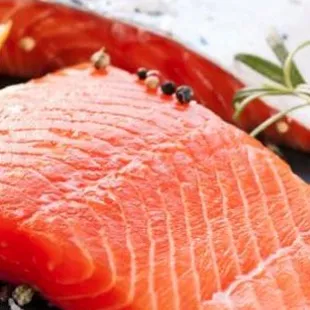 a piece of salmon on a cutting board