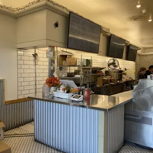 a restaurant kitchen with a counter and a counter top