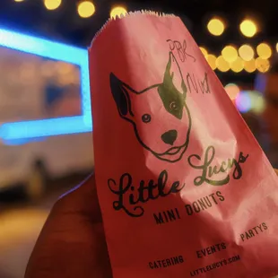 a red bag with a dog on it