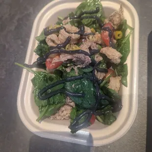 Calamari salad, black garlic aioli, spinach, tomato, vinaigrette. Bueno.