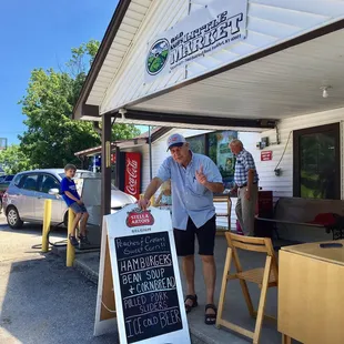 a man standing in front of a store