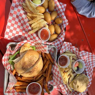 two trays of food on a picnic table