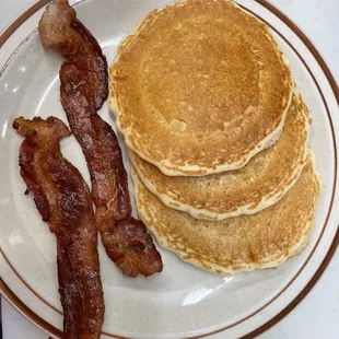 a stack of pancakes and bacon