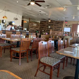 the dining area with tables and chairs