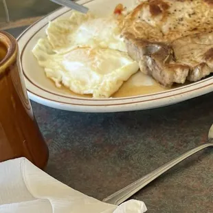 Pork Chop with bone in &amp; sunny side up eggs