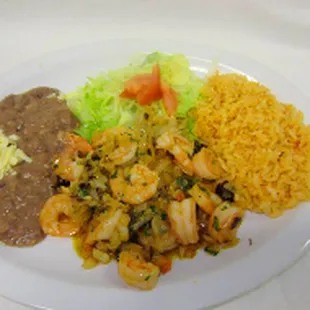 a plate of food with rice, beans, and shrimp