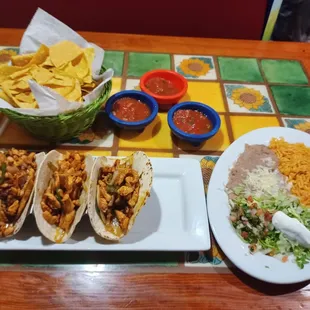 Fajita Tacos (Chicken). Full of chicken, delicious beans, and - as always - 3 salsas of varying degrees of heat.
