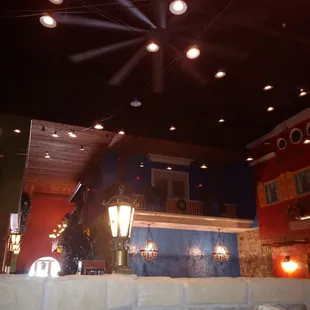 a restaurant with a ceiling fan