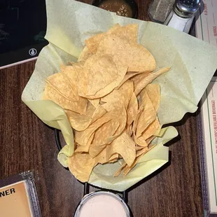 Chips &amp; salsa (top), creamy hot tomato sauce (bottom, comes cold)