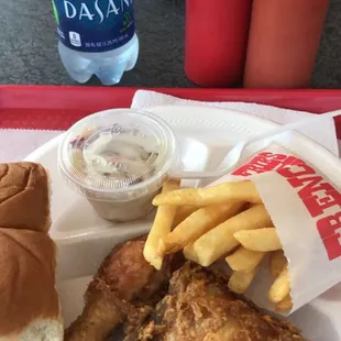 Thigh drumstick snack with coleslaw fries and soft rolls