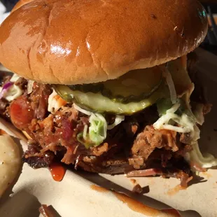 The Jefe sandwich - smoked sausage, chopped brisket, sauce, pickles, slaw.