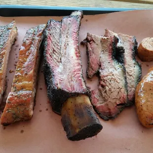 My tray of goodness.  2 pork ribs, one beef rib, 1/4lb fatty brisket and a sausage link.  So freaking delicious!