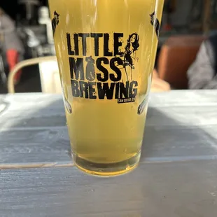 a glass of beer on a table