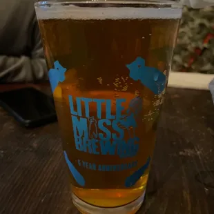 a glass of beer on a table