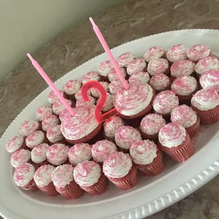 Pink Velvet cupcakes with vanilla buttercream frosting.