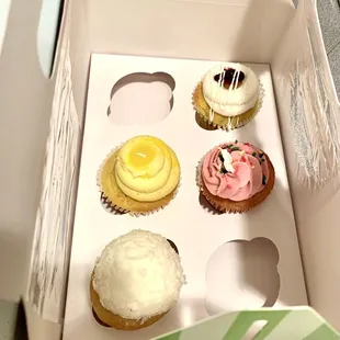 a dozen cupcakes in a box