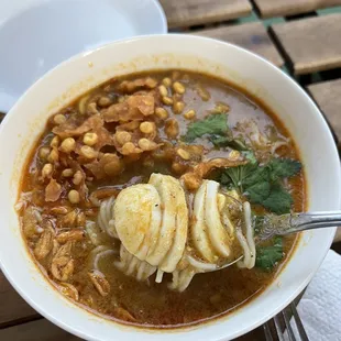a bowl of soup with a spoon in it