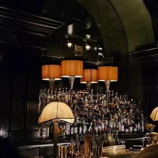 a bar filled with bottles of liquor