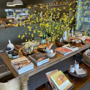 a table of books and flowers