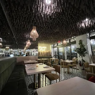 Velvet benches and hanging rope ceiling, very modern interior