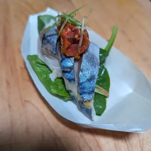 a plate of food with a fish on it