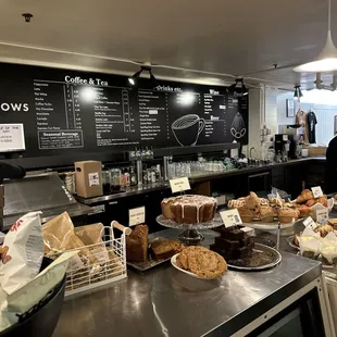 a counter with a variety of pastries