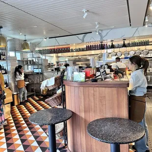 Hot deli section is very busy with all those delivery orders. There are few outdoor tables and chairs. Pizzas are delicious!