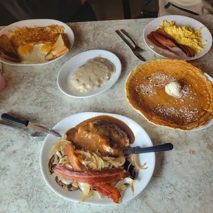 Giant pancakes and liver and onions with mashed potatoes and gravy with BACON
