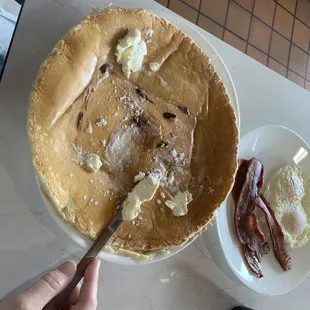 Gigantic pancake - alongside eggs and bacon