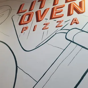 a hand holding a slice of pizza