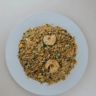 a plate of fried rice with shrimp