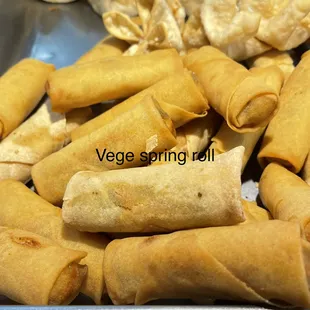 a pile of vegetable spring rolls