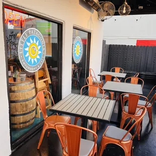 Cute front patio with fan and heater options for patio dining