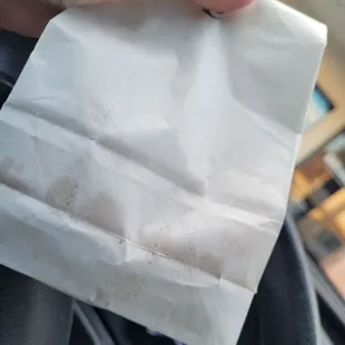 a hand holding a piece of paper