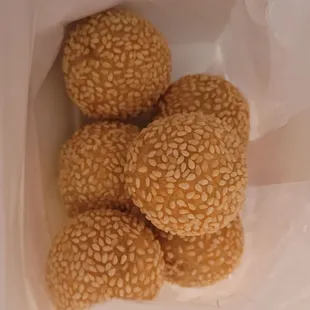 sesame buns in a paper bag